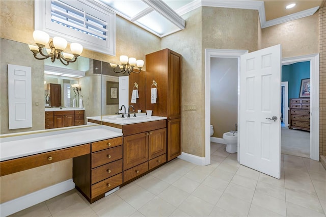 bathroom featuring vanity, a high ceiling, a bidet, ornamental molding, and a notable chandelier