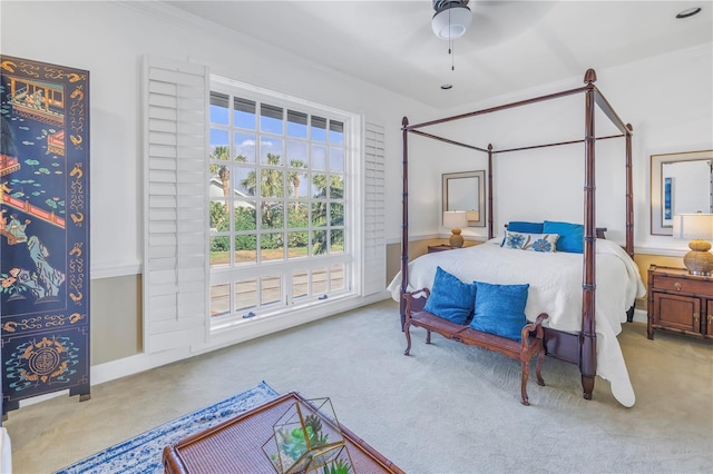 bedroom with ceiling fan and light colored carpet