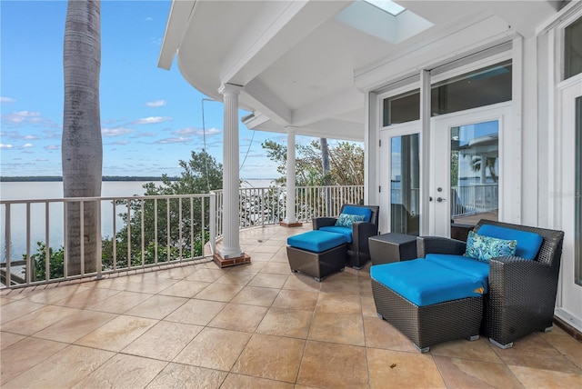 view of patio featuring a water view, an outdoor hangout area, and french doors