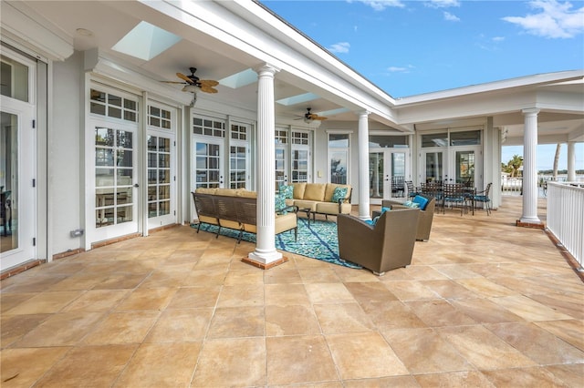 view of patio featuring french doors, an outdoor living space, and ceiling fan