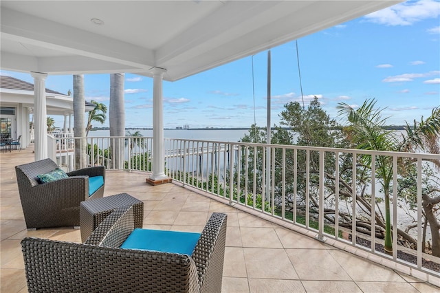 balcony featuring a water view