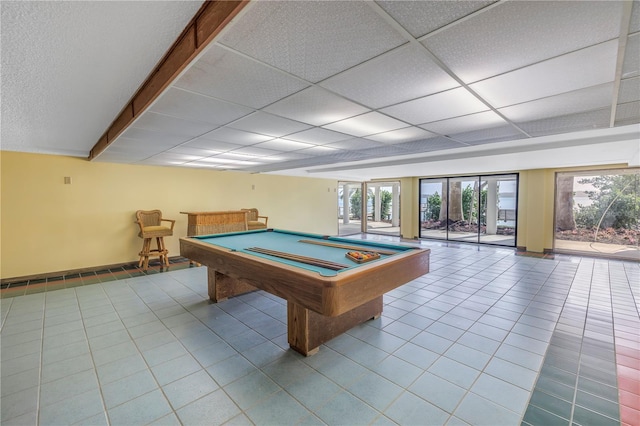 playroom with tile patterned floors, a drop ceiling, and billiards