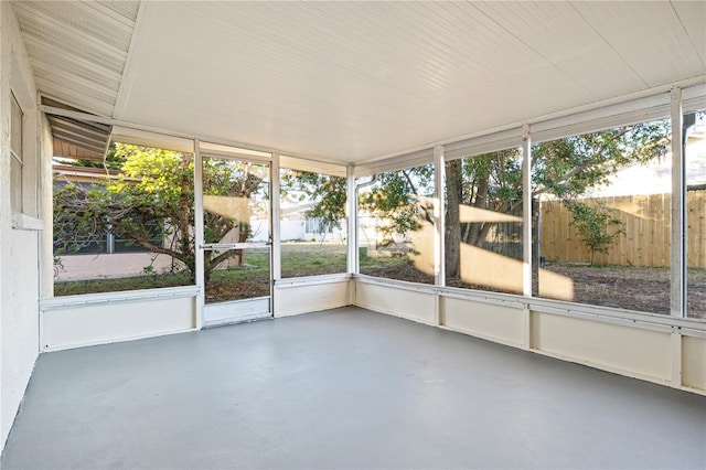 unfurnished sunroom featuring a wealth of natural light