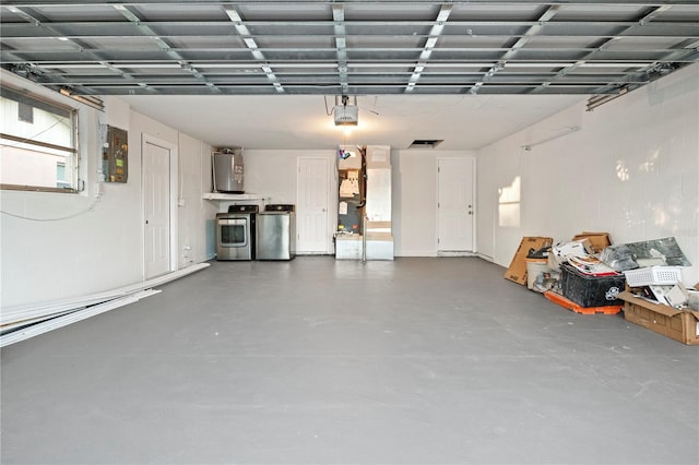 garage featuring a garage door opener, electric panel, washing machine and dryer, water heater, and heating unit