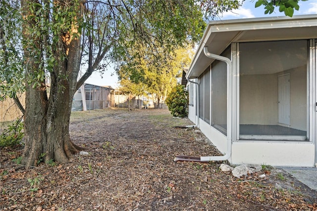 view of yard featuring a sunroom