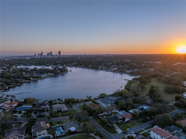 aerial view at dusk with a water view