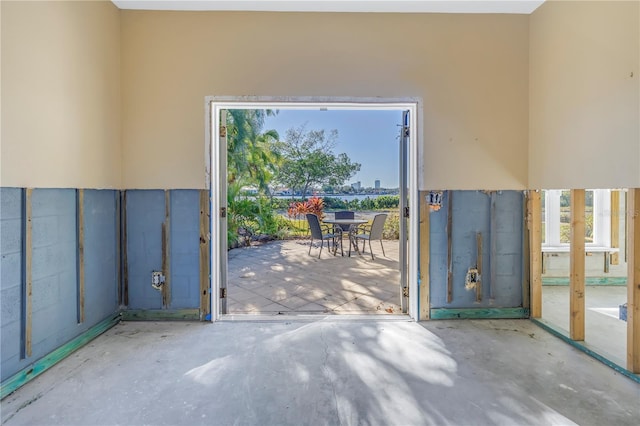 doorway to outside with concrete flooring