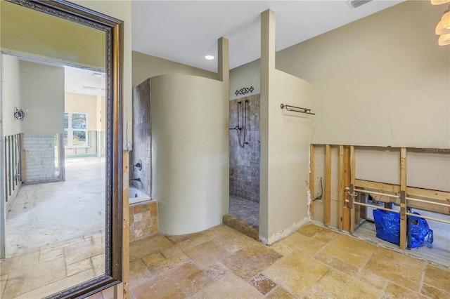 bathroom featuring separate shower and tub