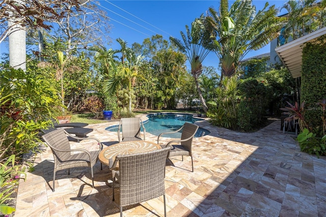 view of patio featuring a fenced in pool