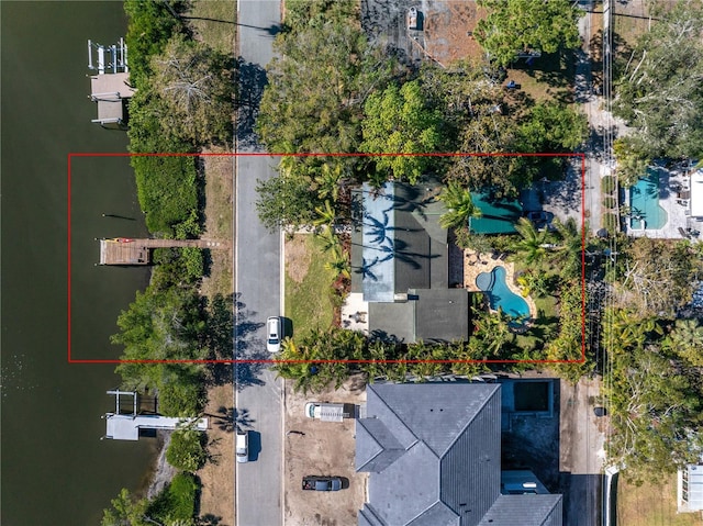 birds eye view of property featuring a water view