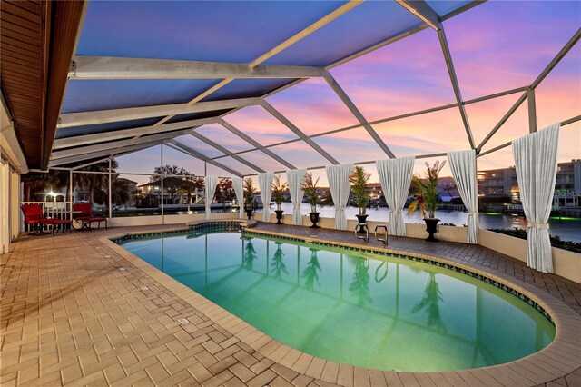 pool featuring a lanai and a patio