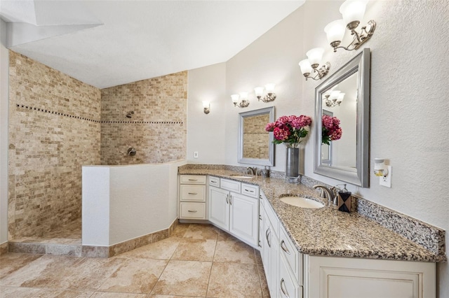 bathroom featuring walk in shower, a sink, and double vanity