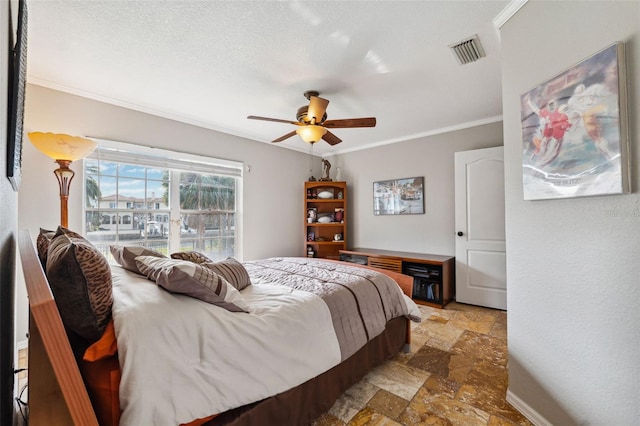 bedroom with stone tile flooring, visible vents, crown molding, and ceiling fan