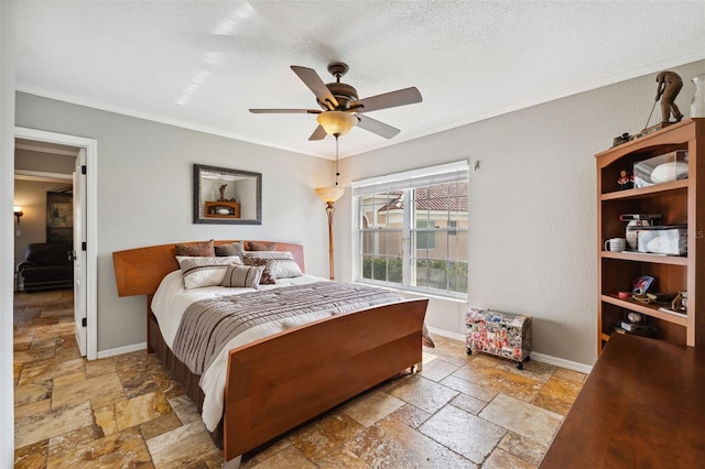 bedroom with baseboards, stone tile flooring, and crown molding