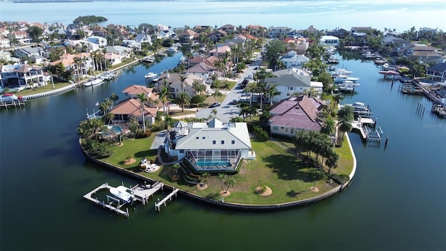 birds eye view of property with a residential view and a water view