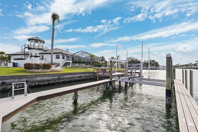 view of dock with stairs, a water view, and boat lift