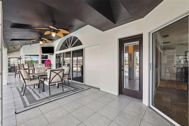 view of patio featuring ceiling fan
