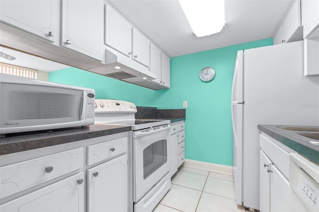 kitchen with white cabinetry, light tile patterned flooring, and white appliances