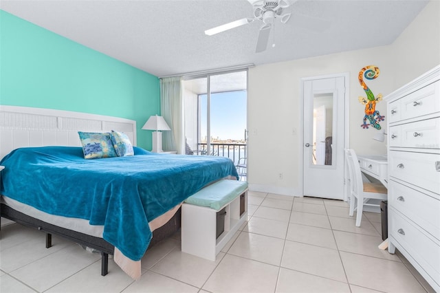 tiled bedroom featuring a textured ceiling, access to outside, and ceiling fan