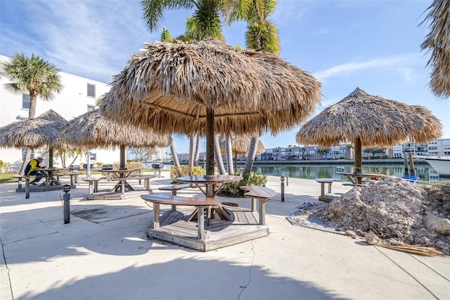 view of property's community featuring a gazebo and a water view