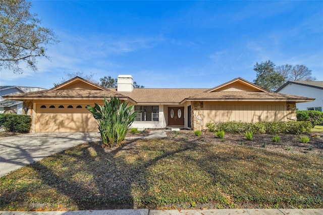 ranch-style house with a garage and a front yard