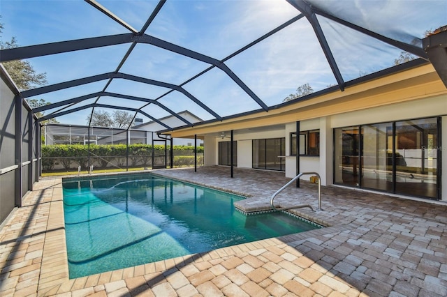 view of swimming pool with a patio and glass enclosure