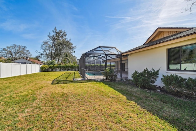 view of yard featuring a lanai and a fenced in pool