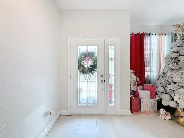 entrance foyer featuring light tile patterned floors