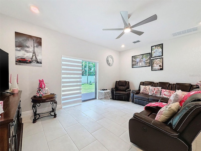 living room featuring ceiling fan and light tile patterned floors