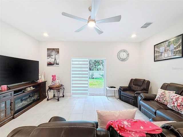 living room with ceiling fan and light tile patterned floors