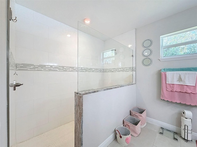 bathroom featuring tile patterned floors and tiled shower