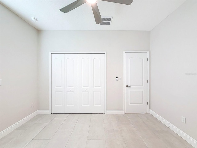 unfurnished bedroom featuring ceiling fan