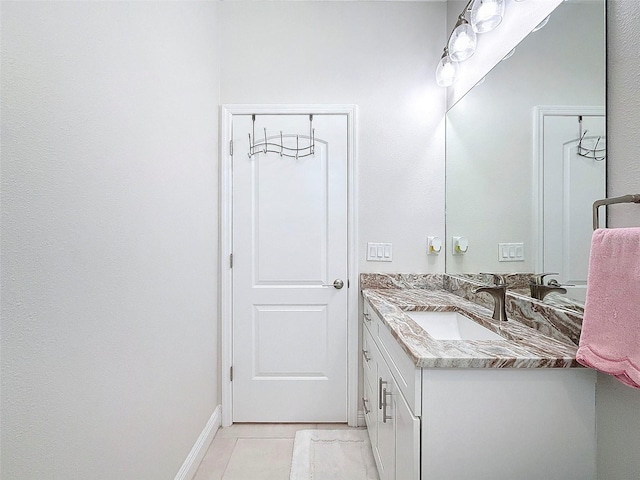 bathroom featuring tile patterned flooring and vanity