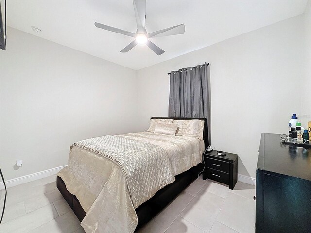 bedroom featuring tile patterned floors and ceiling fan