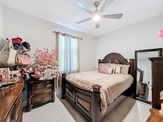 tiled bedroom with ceiling fan