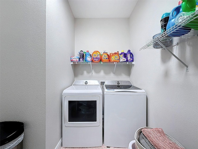 laundry room with washing machine and clothes dryer