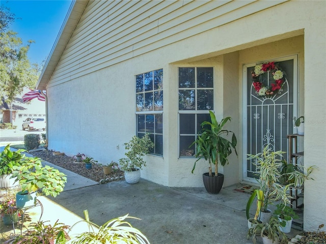 doorway to property with a patio