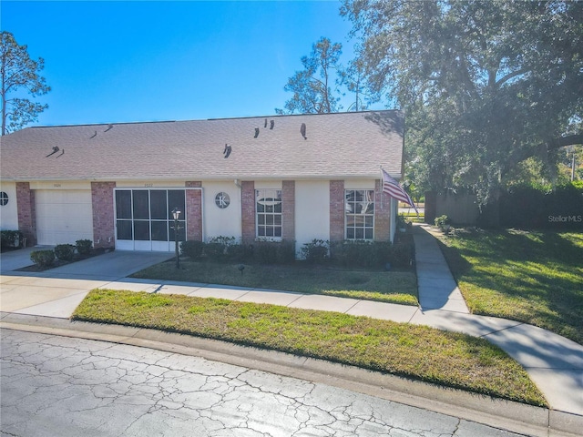 view of front of house with a front lawn and a garage