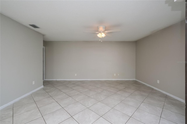 unfurnished room featuring ceiling fan and light tile patterned flooring