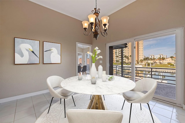 dining room featuring light tile patterned floors, a chandelier, and ornamental molding