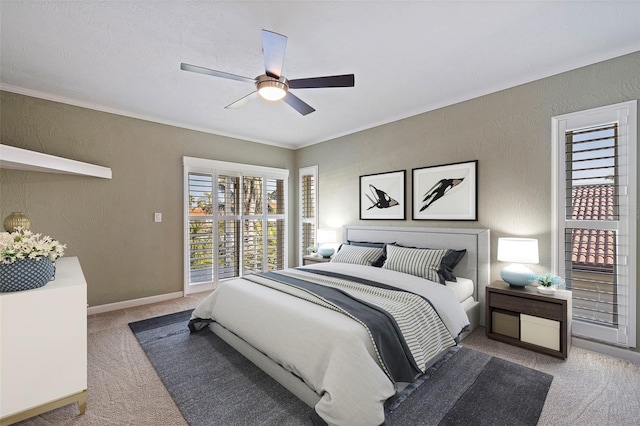 bedroom with ceiling fan, crown molding, and light colored carpet