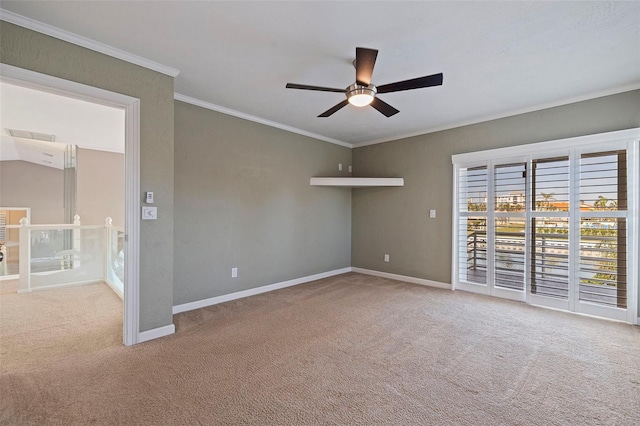 unfurnished room featuring ceiling fan, ornamental molding, and light carpet