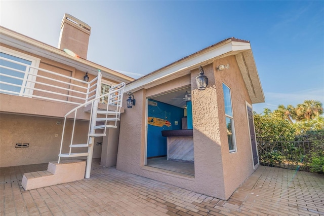 view of side of property featuring a patio area