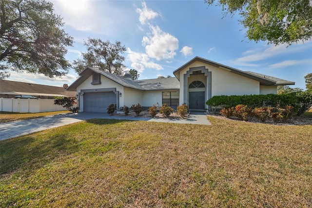 ranch-style home with a front yard and a garage