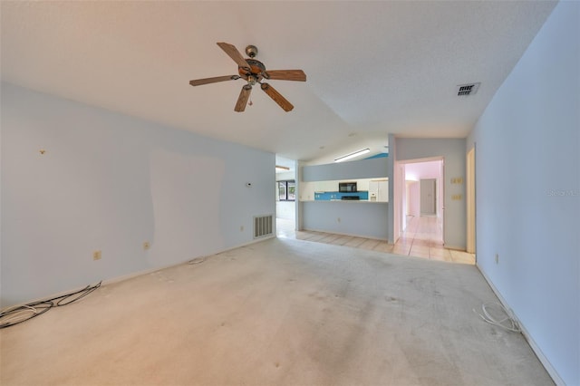 unfurnished living room featuring light carpet, ceiling fan, and lofted ceiling