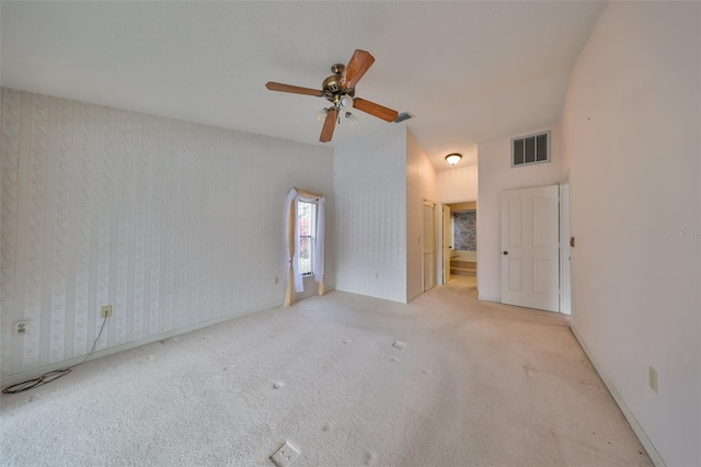 unfurnished room with ceiling fan and light colored carpet