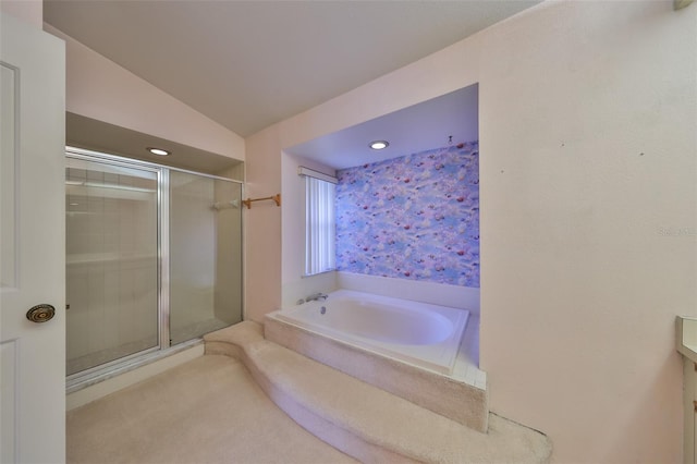 bathroom with separate shower and tub and lofted ceiling