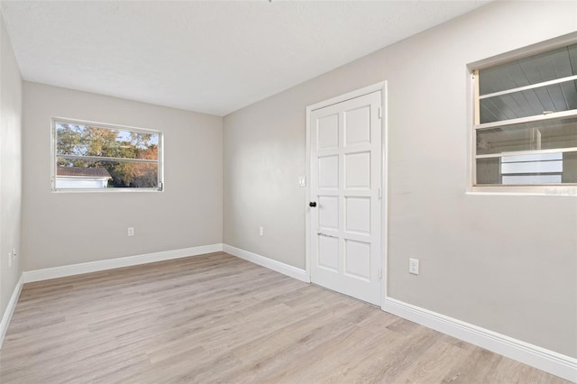 spare room with light wood-type flooring