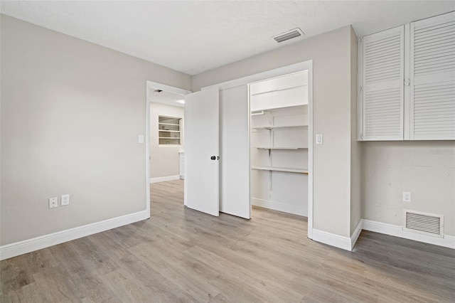 unfurnished bedroom with light hardwood / wood-style flooring