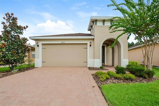 view of front of home with a garage